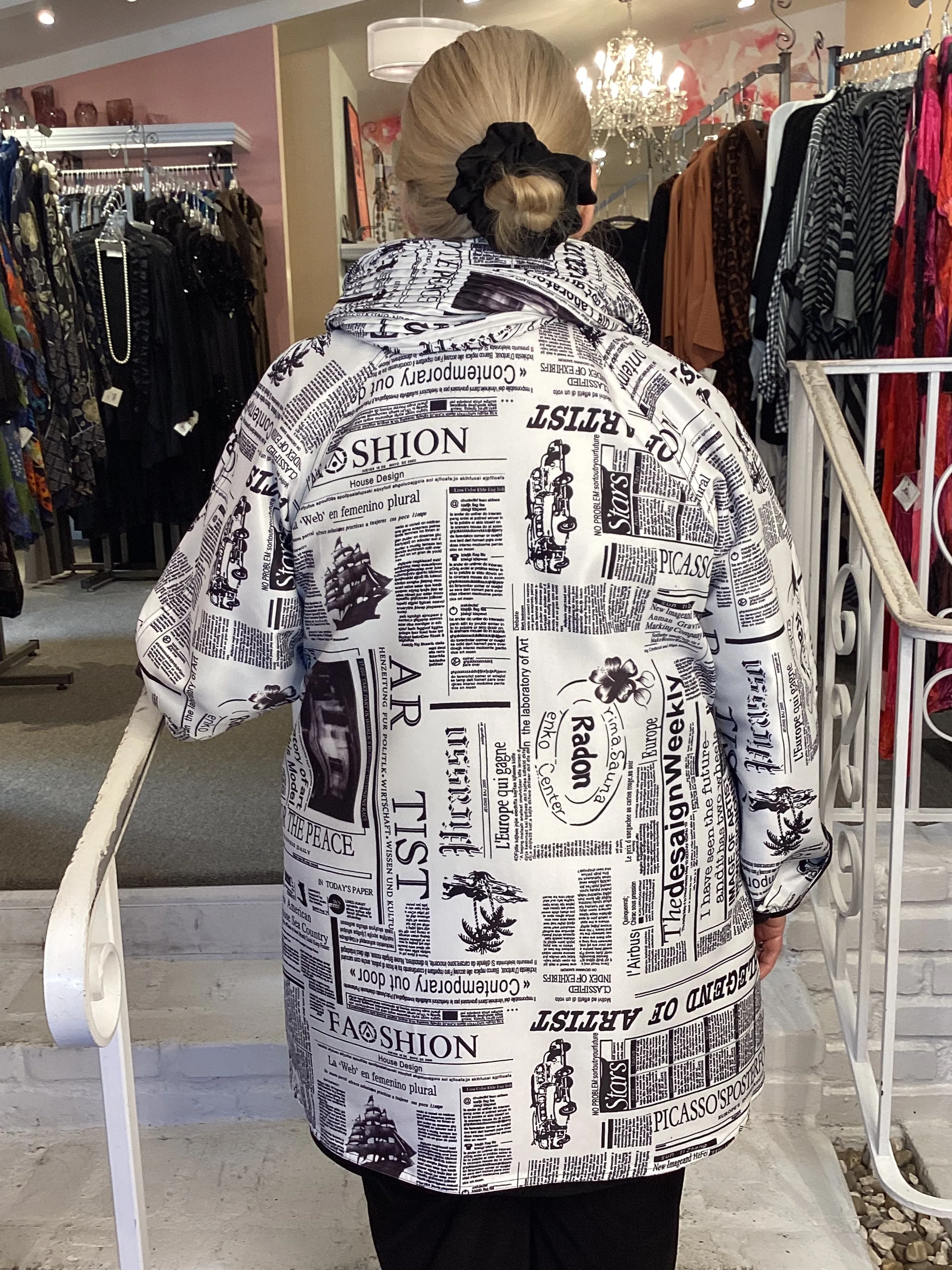 REV RAINCOAT - NEWSPAPER